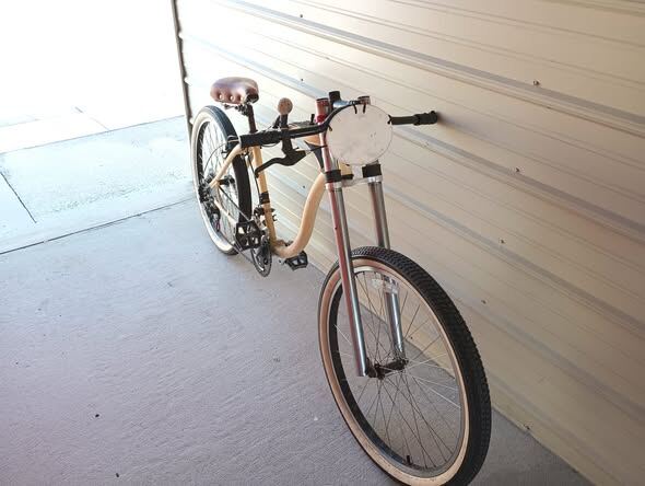 Board-track style build with springer fork and leather saddle