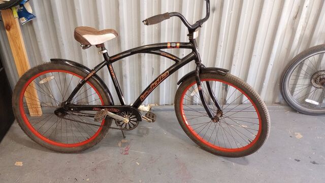 Black cruiser with orange-red rims and tank graphics