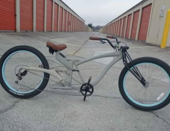 Stretched cream cruiser with brown leather saddle in the shop corridor