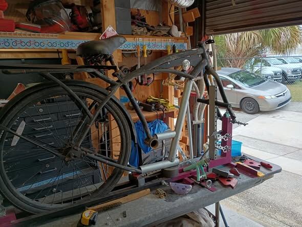 A frame mid-fabrication on the outdoor bench